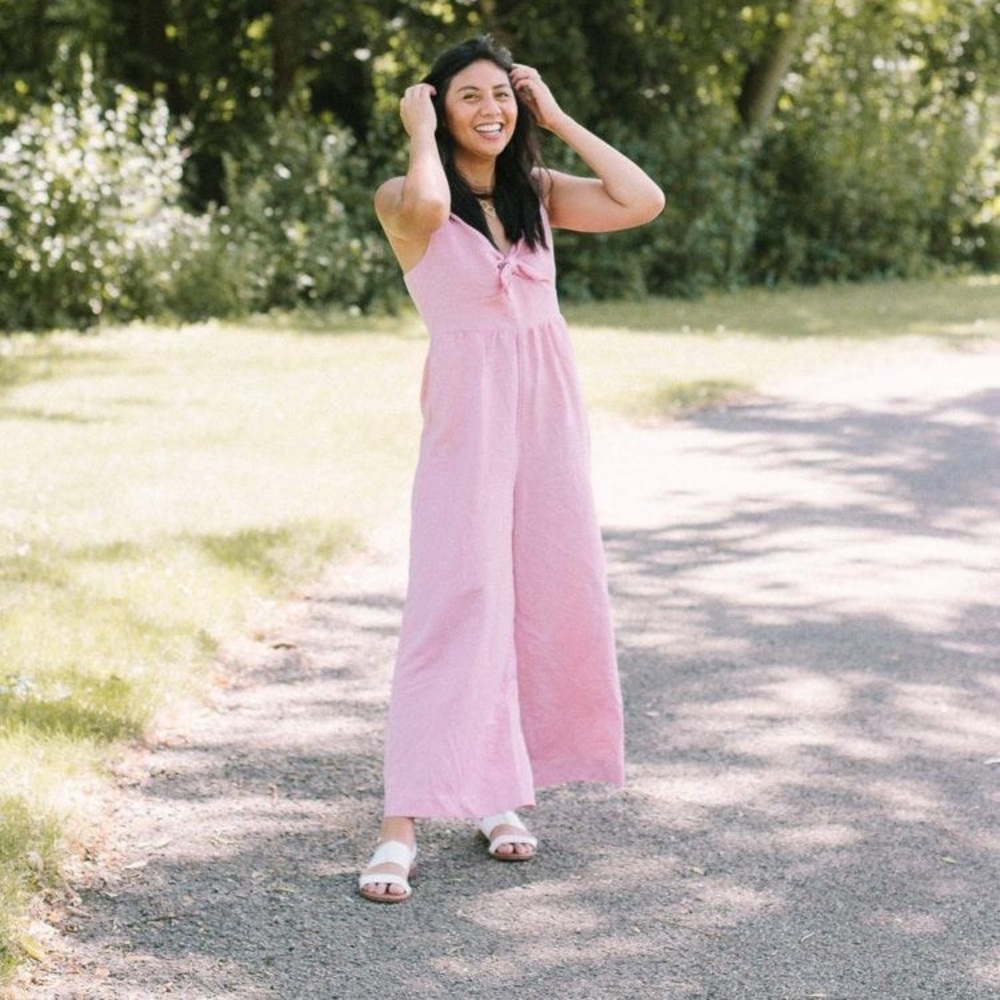 Pink linen jumpsuit with tie front